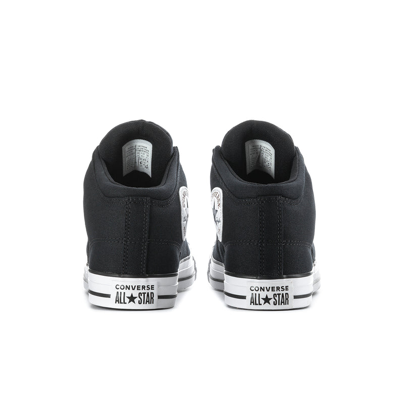 Men's black mid-top sneakers showing white heel branding and flat rubber outsole