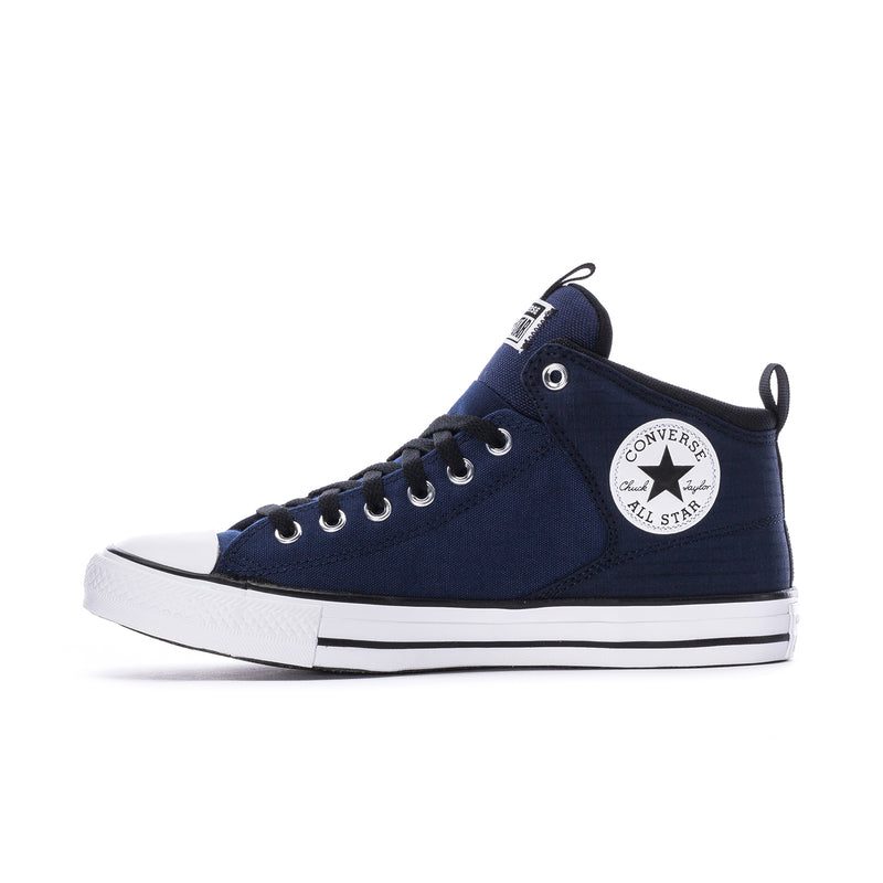 Navy low-profile high-top sneakers with white sole, black laces, and side logo patch
