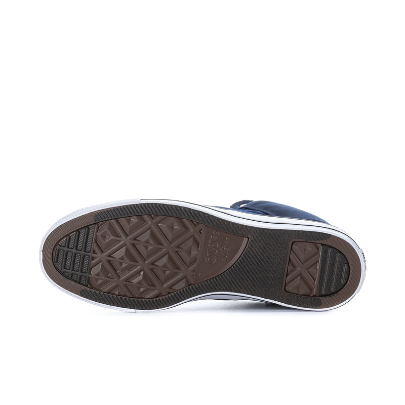Outsole view of navy high-top sneakers showing brown tread and white sidewall