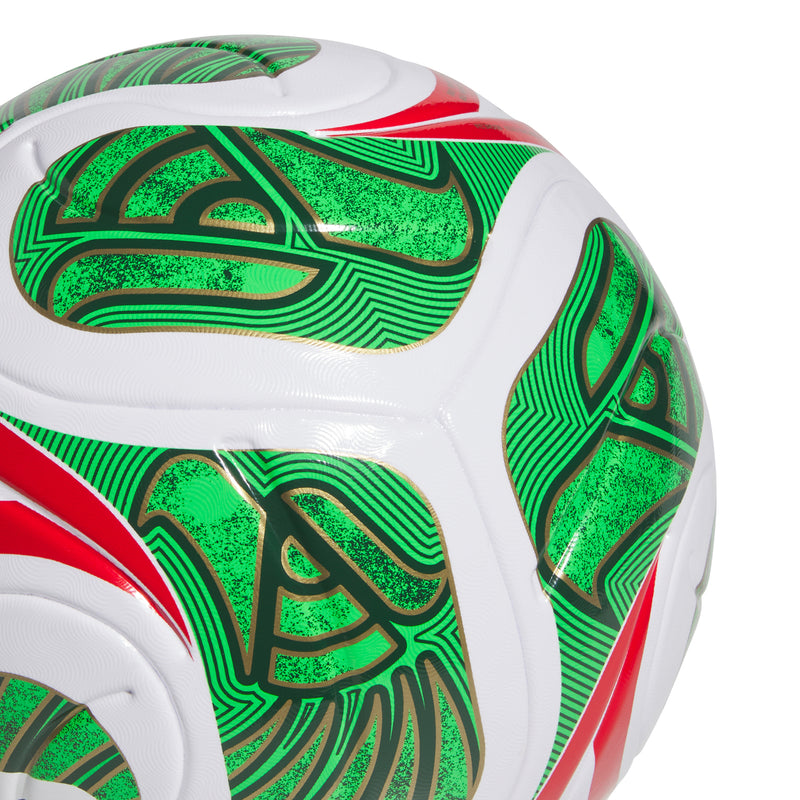 Closeup soccer ball surface with green patterned graphics, red stripe, and white panels.