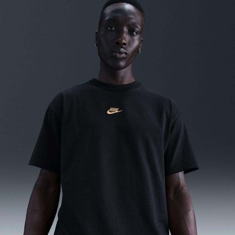 Men's black Nike short-sleeve t-shirt with gold swoosh logo on chest