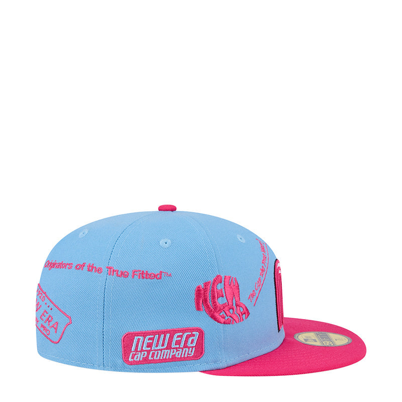 Sky blue baseball cap with red side graphics, including New Era patch logo