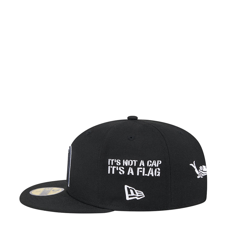 Black flat-brim cap with white “It’s not a cap…” text and New Era flag logo