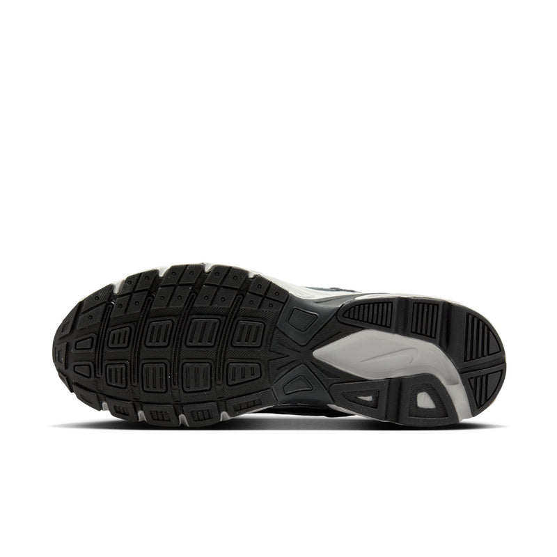 Men's sneaker outsole with textured traction tread and dark rubber side sections