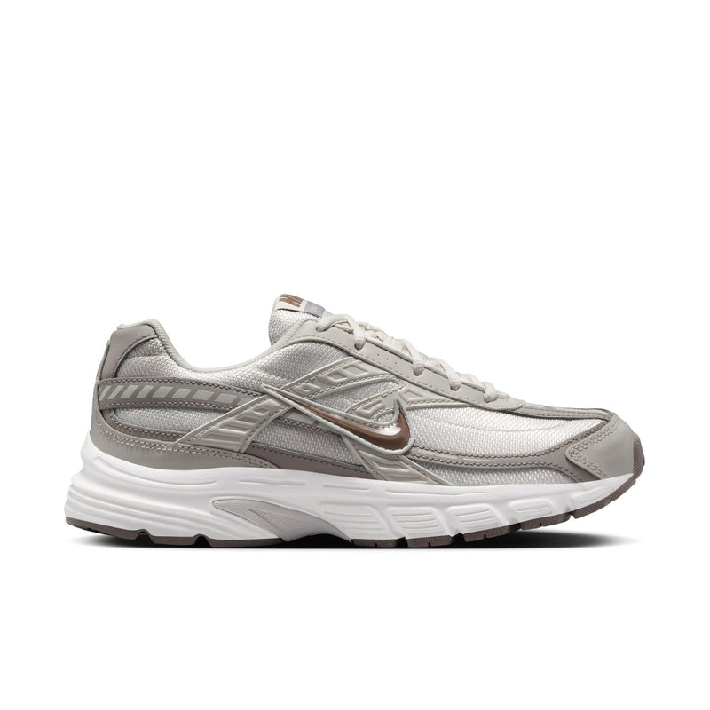 Nike women's running shoes, light bone with phantom and mink brown accents