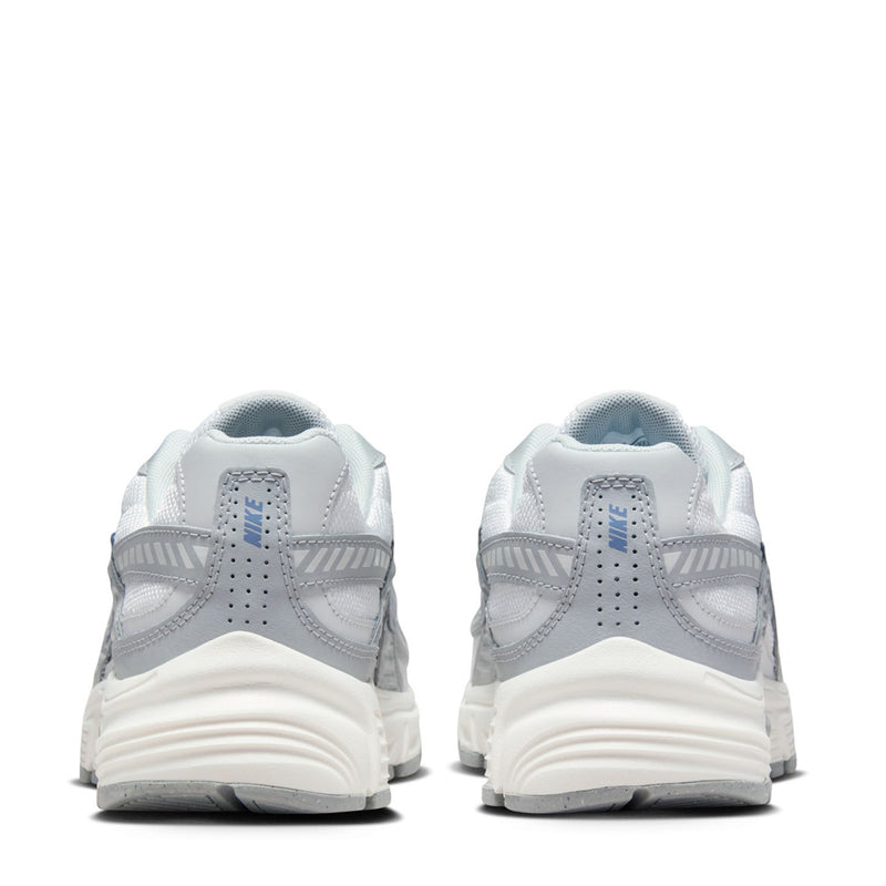 Women’s white lace-up running shoes with gray heel tabs and patterned midsole cushioning.