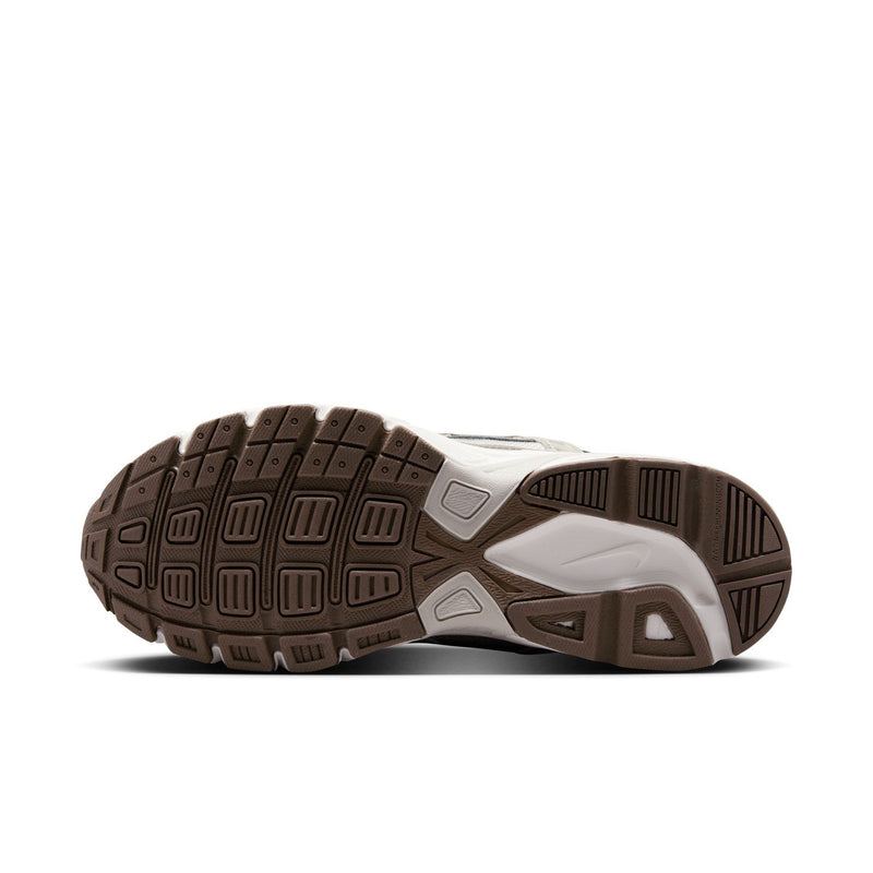 Nike women's running shoes, outsole view with rubber tread and traction pods