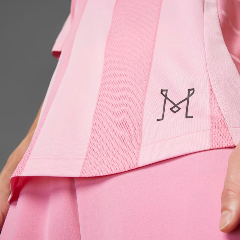 Light pink jersey side panel with mesh texture and black Under Armour-style logo