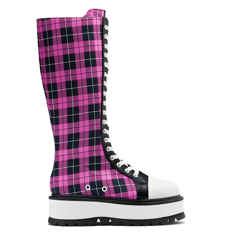 A pair of long platform boots with a pink checkered pattern, featuring a chunky sole and lace-up closure.
