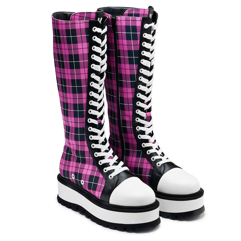 A pair of long platform boots with a pink checkered pattern, featuring a chunky sole and lace-up closure - 3/4 view