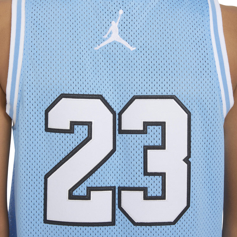 Close-up of youth jersey number 23 graphic on light blue mesh fabric