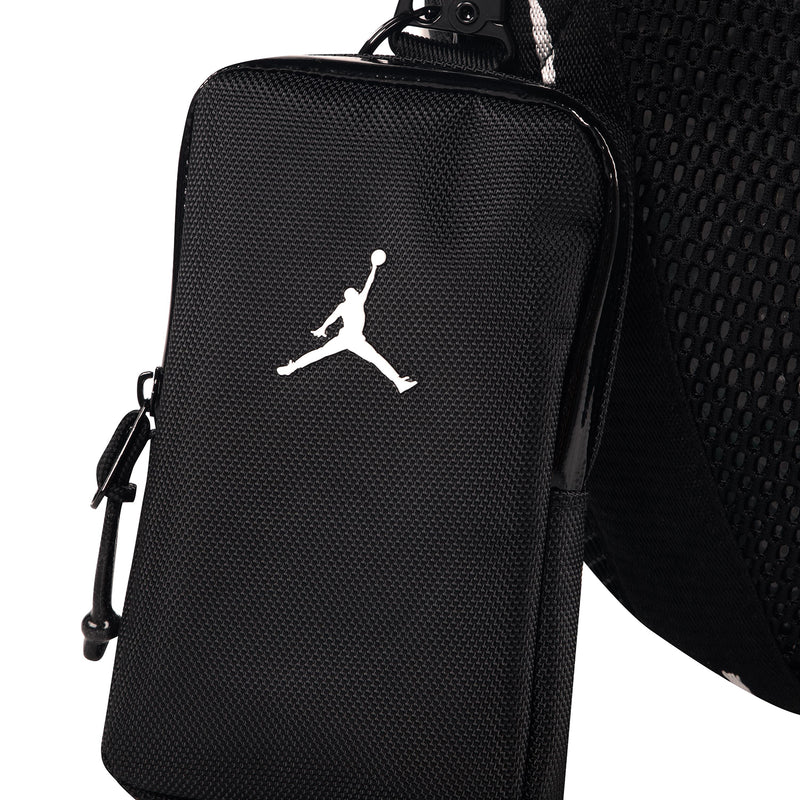Black mesh ball carrier with attached front zip pouch and white Jumpman logo