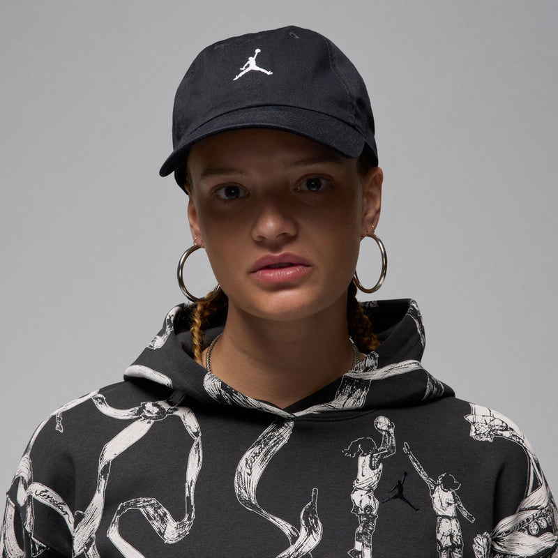 Black cap with white Jumpman logo, worn on a model