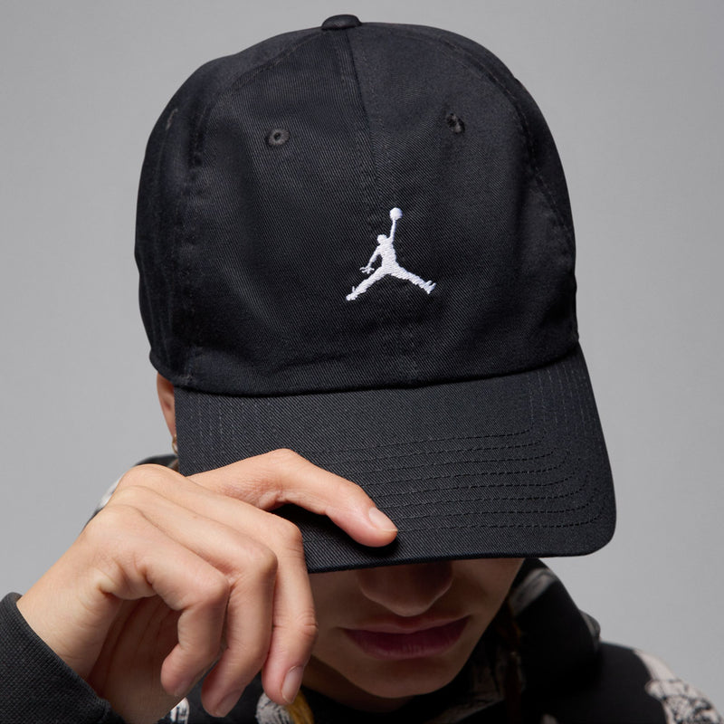 Black cap back view with white Jumpman logo and curved brim