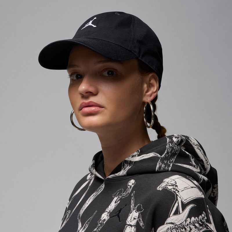Black cap with white Jumpman logo, side view on model