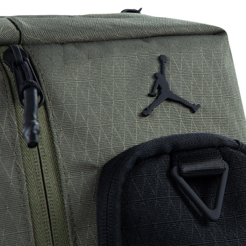 Medium olive crossbody bag detail with textured pattern and Jumpman logo on pocket