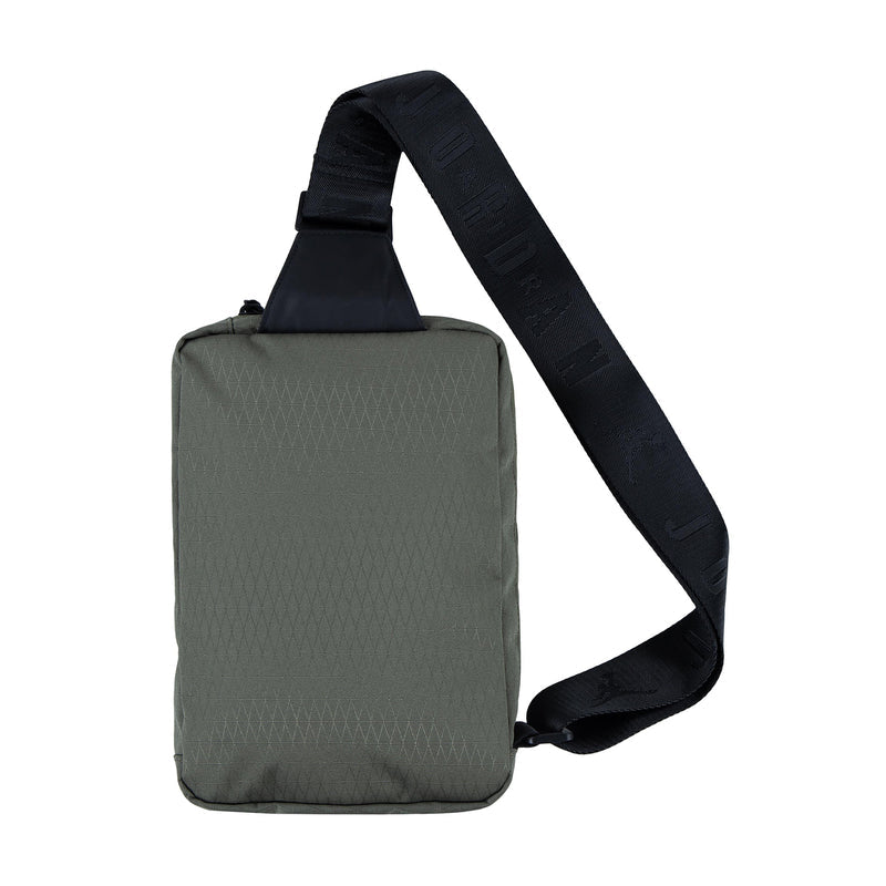 Medium olive crossbody bag with black adjustable shoulder strap and small exterior detail