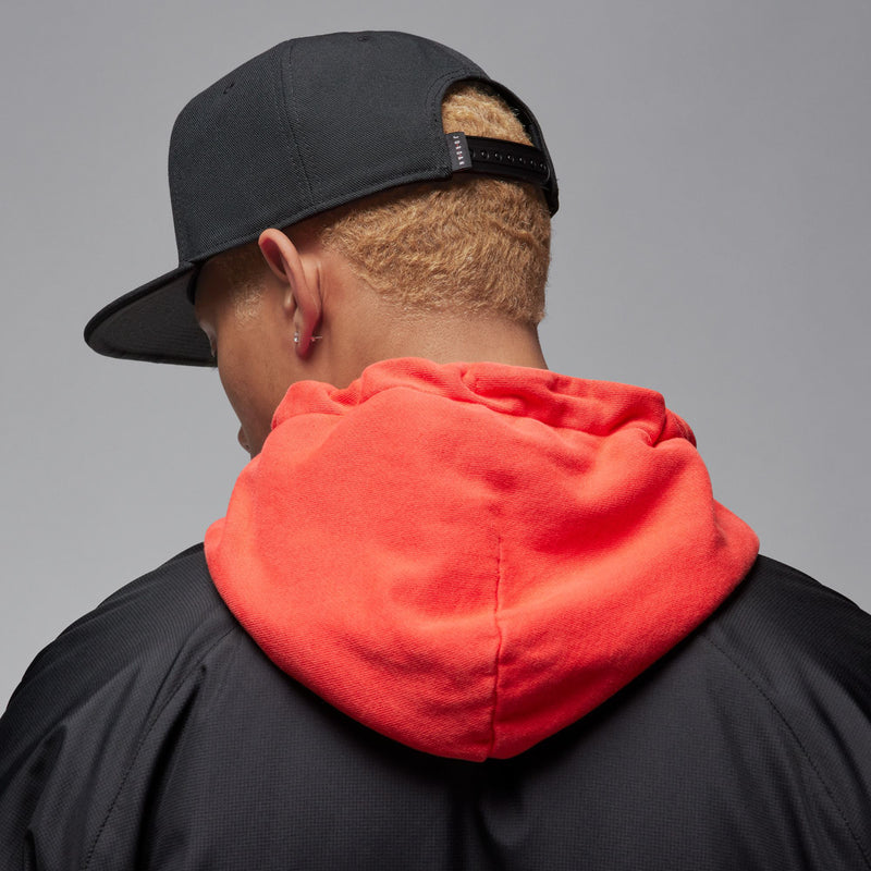 Black snapback cap with white Jumpman logo, worn from the back