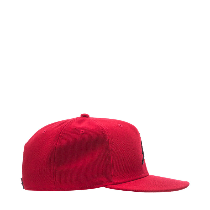 Red snapback cap, side view with small ventilation holes on crown