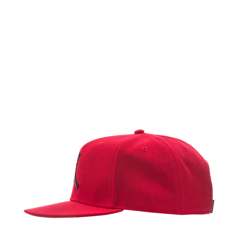 Red snapback cap, angled side view with small ventilation holes