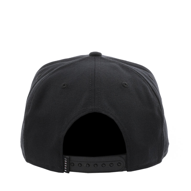 Black snapback cap with adjustable back strap and ventilation eyelets
