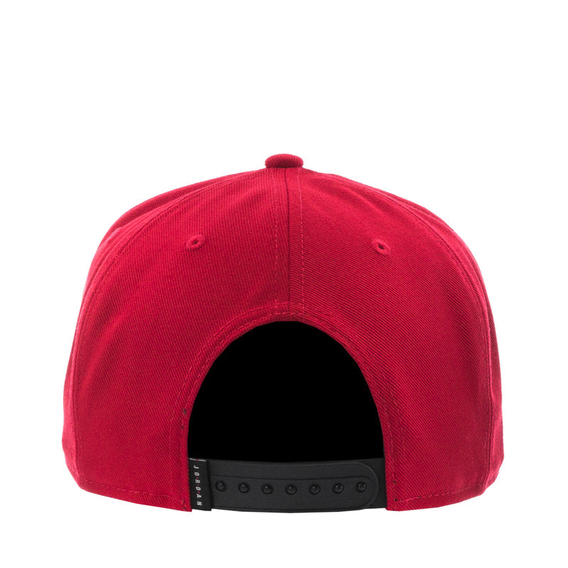 Red snapback cap back view with black interior band and eyelets