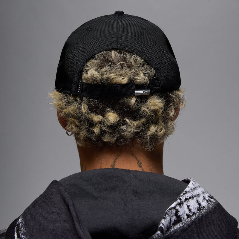 Black cap back with adjustable strap and small logo tag
