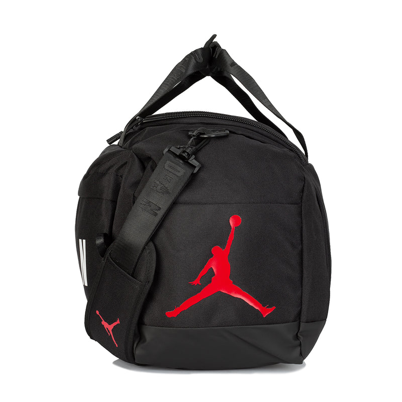 Black small duffel bag with red Jumpman logo, adjustable shoulder strap and zip top