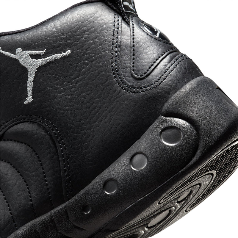 Close-up of black sneaker side with Jumpman logo and perforated midsole studs