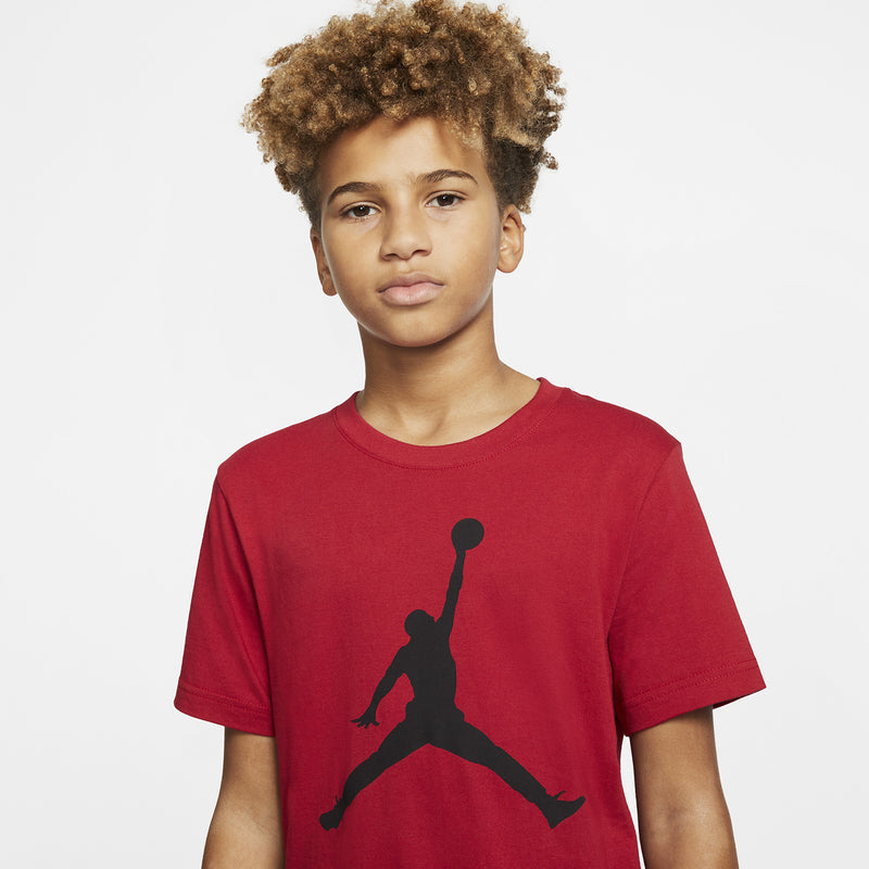 Youth red crewneck T-shirt with black Jumpman graphic at center chest