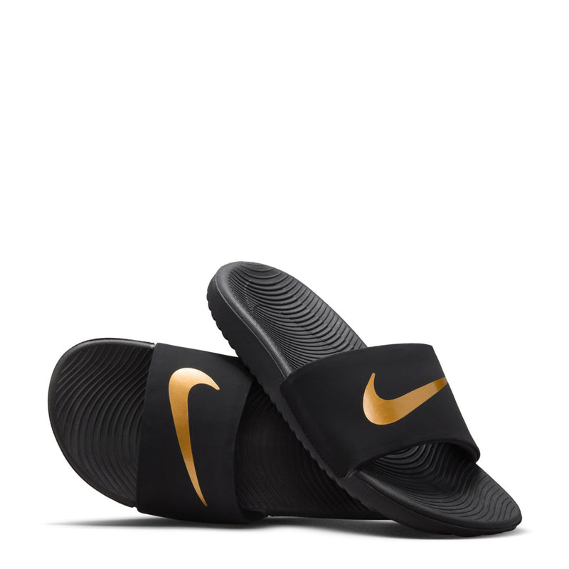 Kids' black slide sandals pair view with gold swooshes and textured footbed