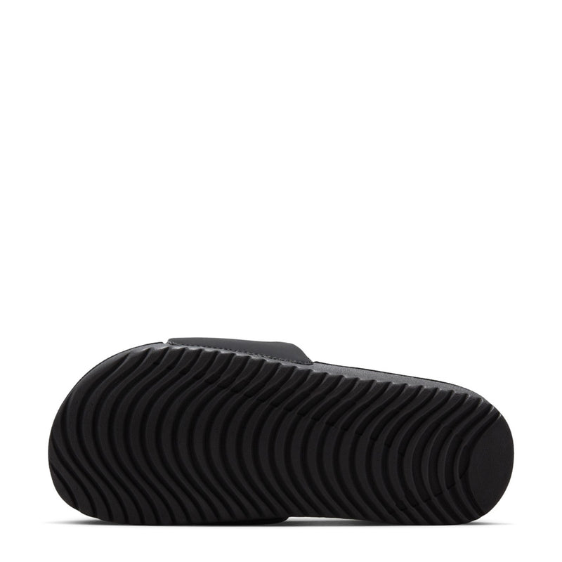 Kids' black slide sandals—underside with textured non-slip tread