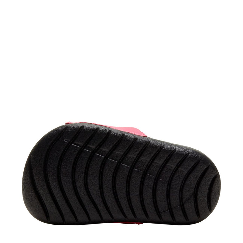 Toddler slide sandal outsole view with black textured tread and pink upper