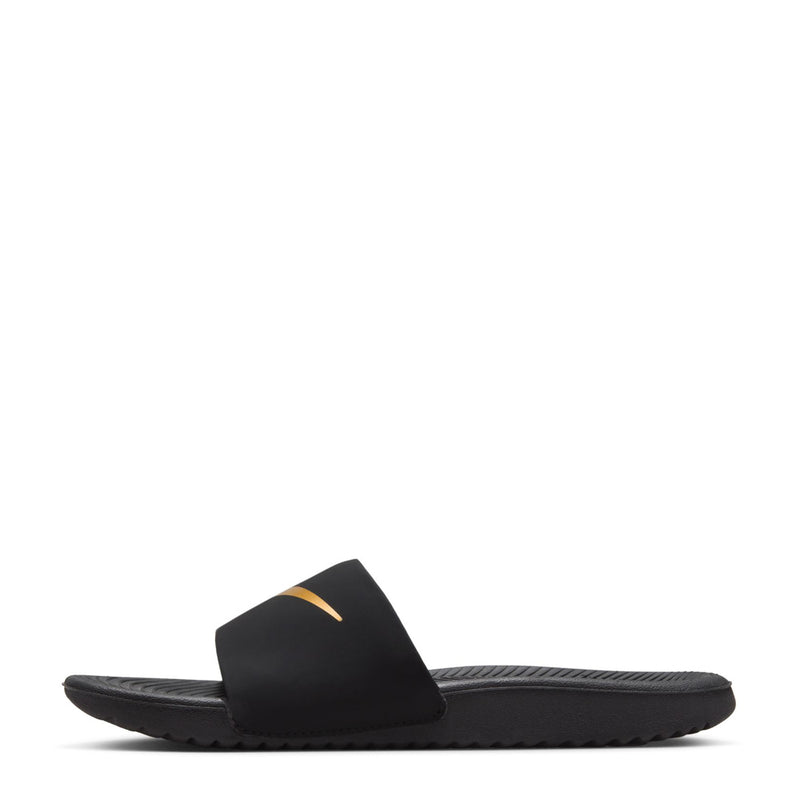 Youth black slide sandals, side view, Nike gold swoosh on upper strap