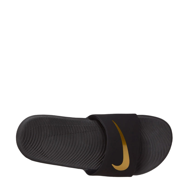 Youth black slide sandals with ribbed outsole and Nike gold swoosh on strap