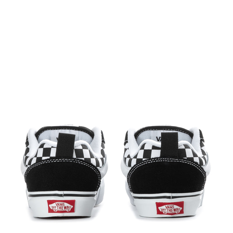 Kids low-top sneakers heel view, black and white checkered collar, red logo patch
