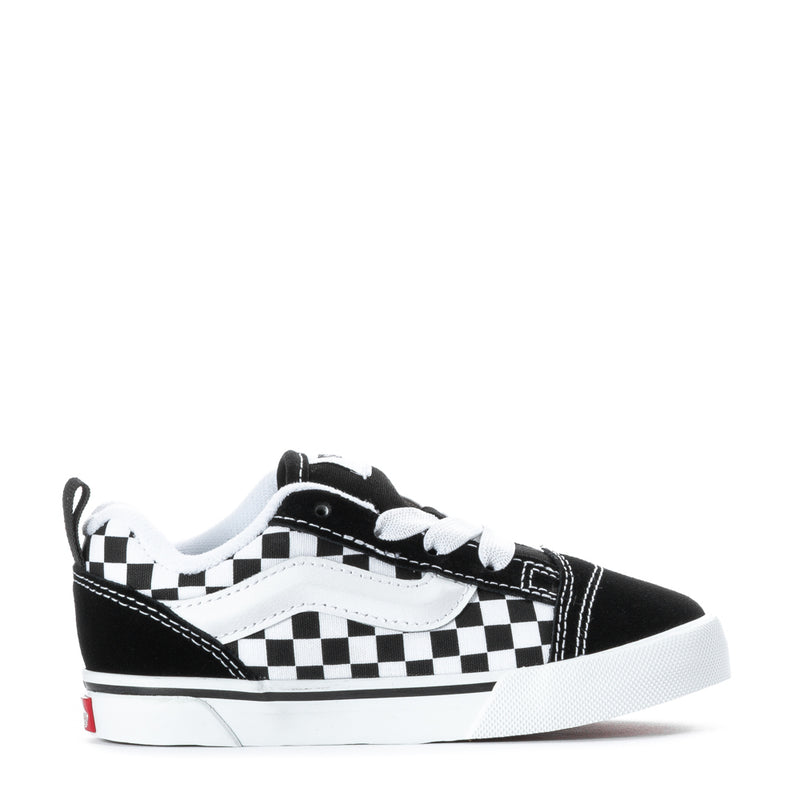 Toddler sneakers in black and white checkerboard, lace-up, low-profile.