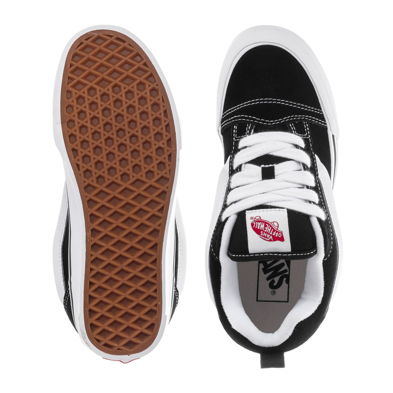 Black and white sneaker with gum rubber outsole and lace-up front; underside view