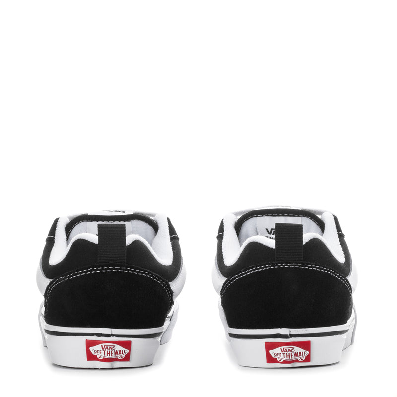 Back view of black youth lace-up sneakers with white heel tab and "Off the Wall" logo.