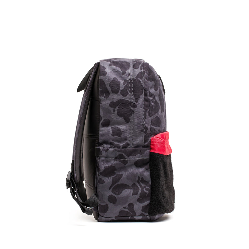 GORUCK black camo backpack with red and black side pocket, rugged rucking gear