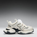 White and black sneaker on a gray background
