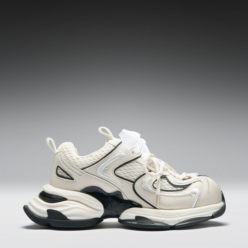 White and black sneaker on a gray background