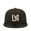 Dark baseball cap with white and gold LA-style monogram logo on front