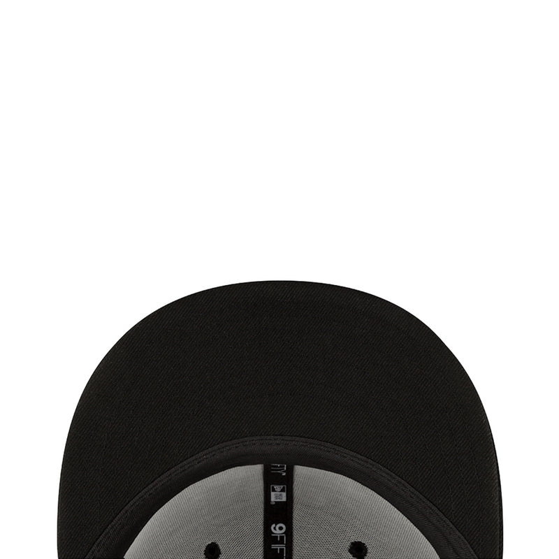 Black baseball cap interior view with fabric seam and label