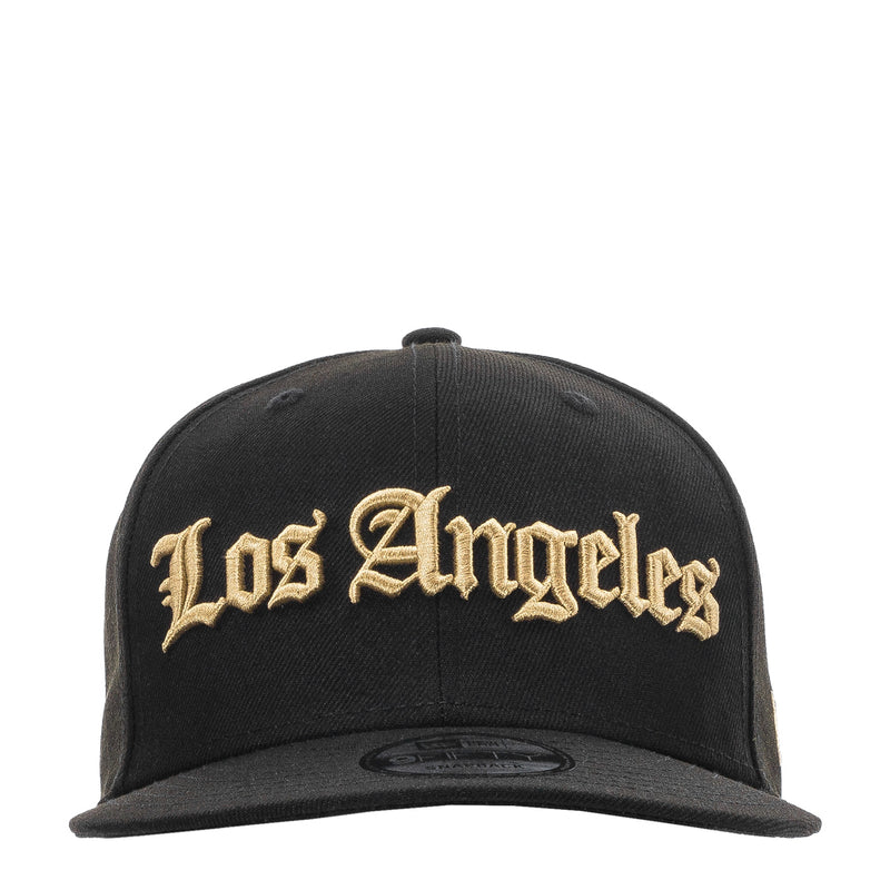 Black baseball cap with gold Los Angeles script front logo