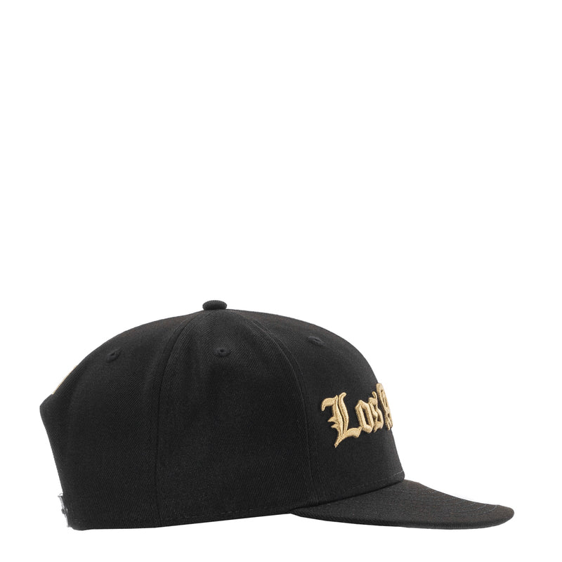 Black baseball cap with small gold side script logo
