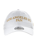 White LAFC fan cap with gold "LOS ANGELES FAN" embroidery and flat brim