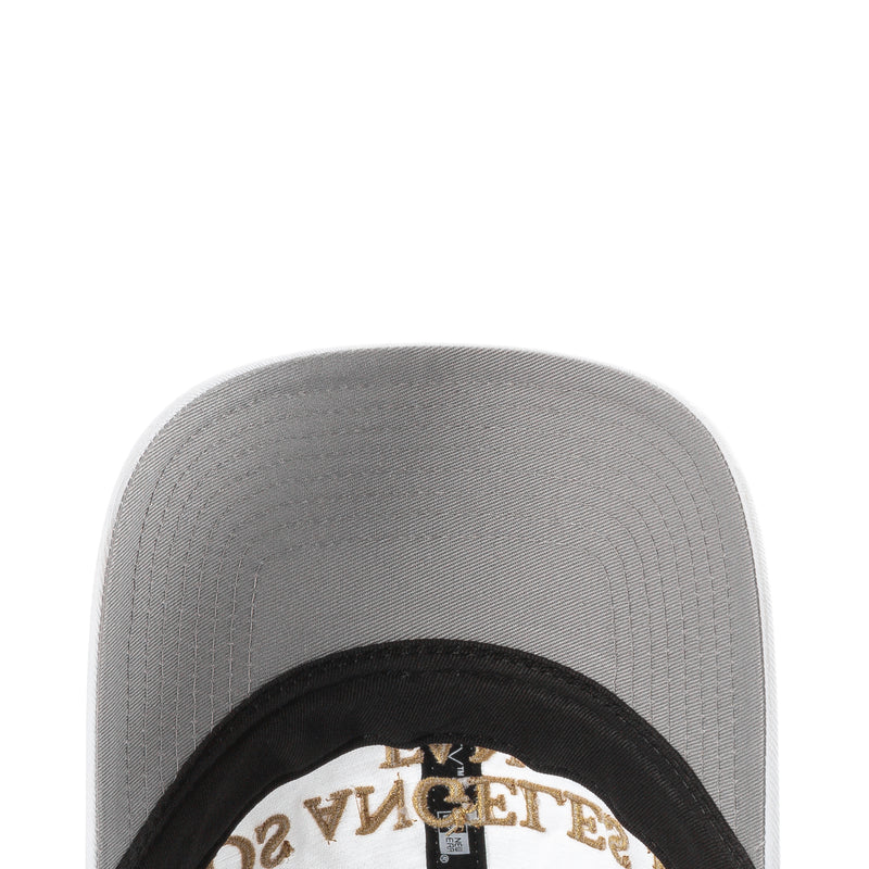 Inside view of white LAFC fan cap with black lining and gold New Era logo