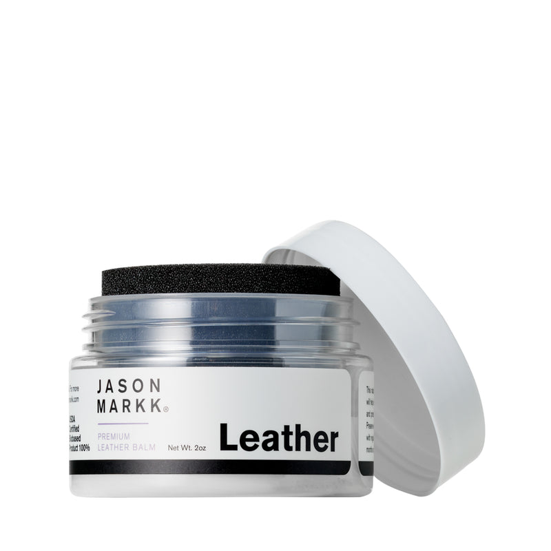 Leather conditioning balm jar with open lid and black foam sponge applicator