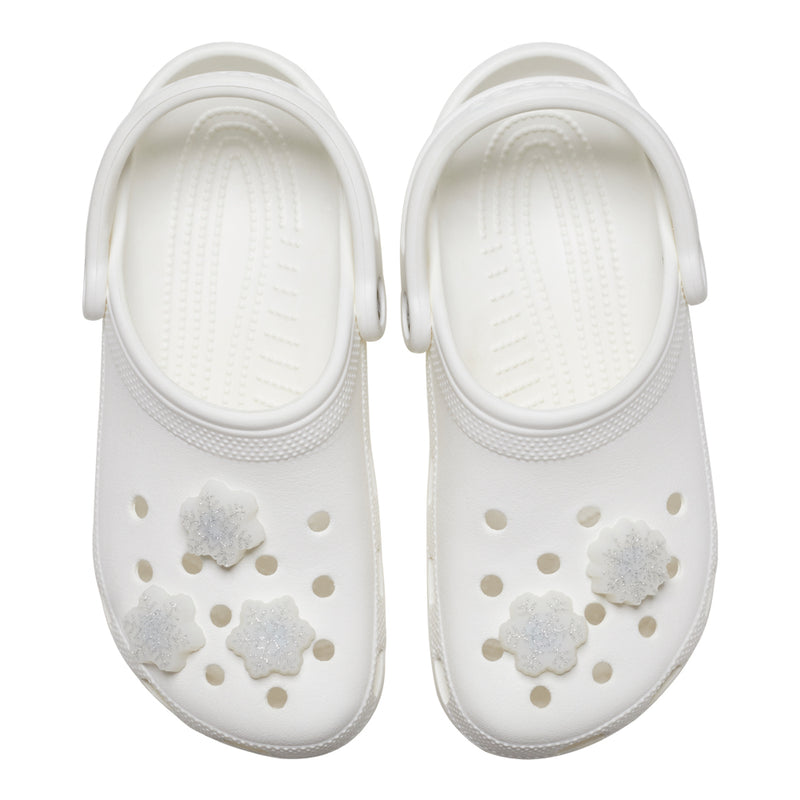 White clog shoes with glittery LED snowflake Jibbitz charms attached